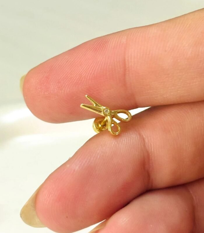 Tiny Snip Gold Ear Piercing